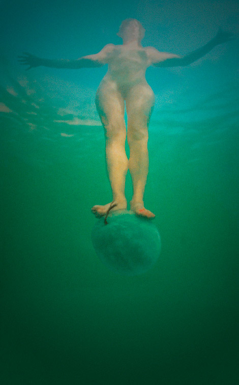 Standing on a Watermelon in the Dead Sea